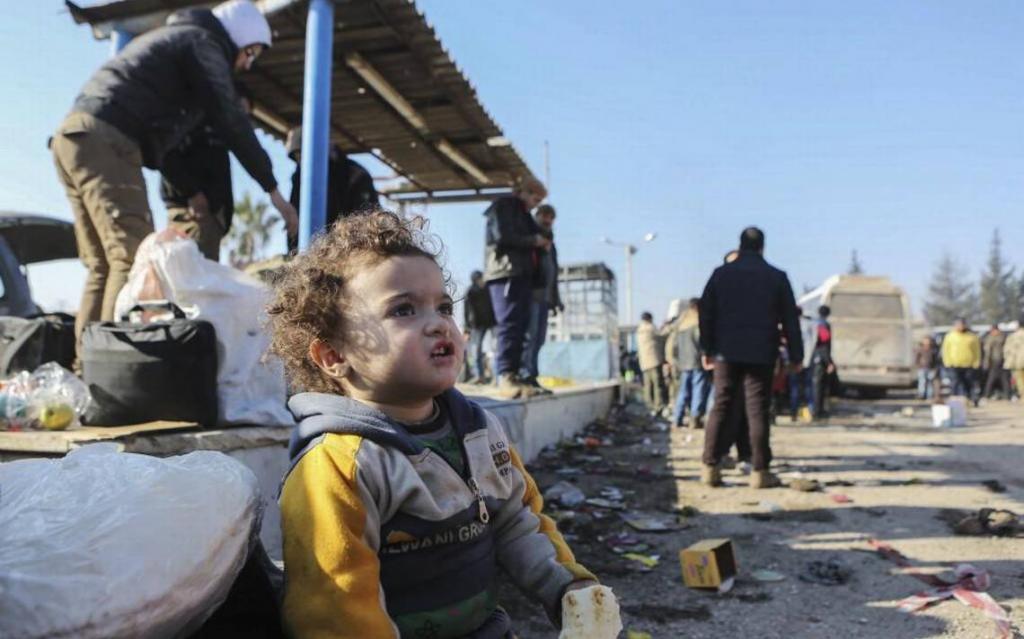 Refugee child awaits humanitarian assistance