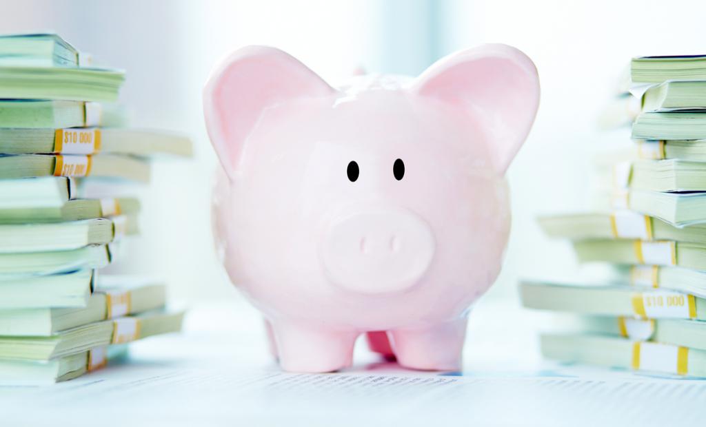 piggy bank and books