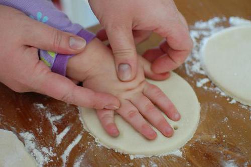 casts of handles and legs of a child from salt dough