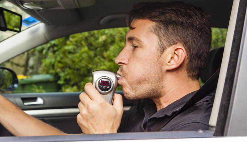 man doing alcohol test