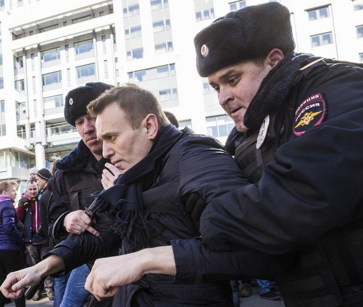 police lead a man to the police to search
