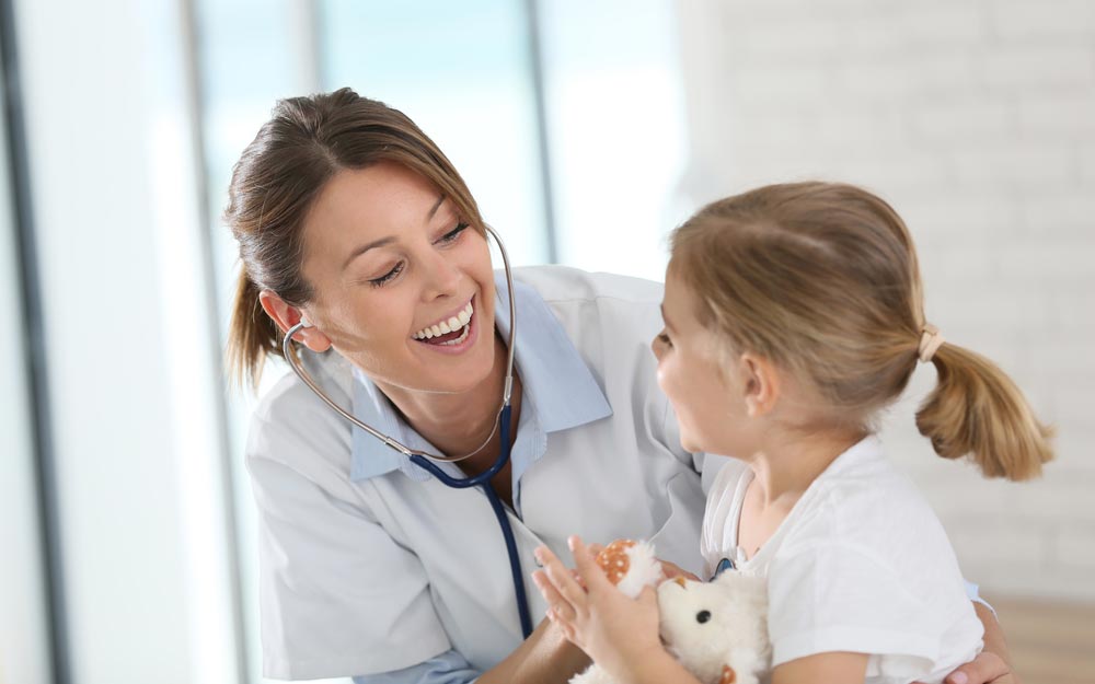 doctor is listening to a child