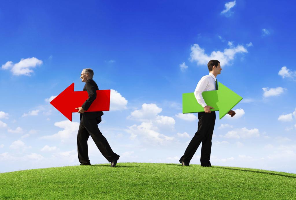 men hold red and green arrow