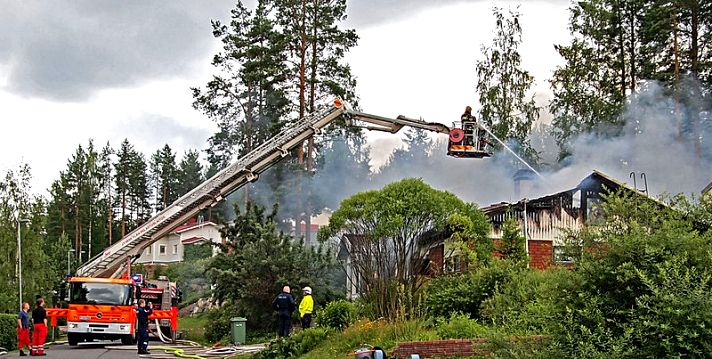 firefighters extinguish a small building