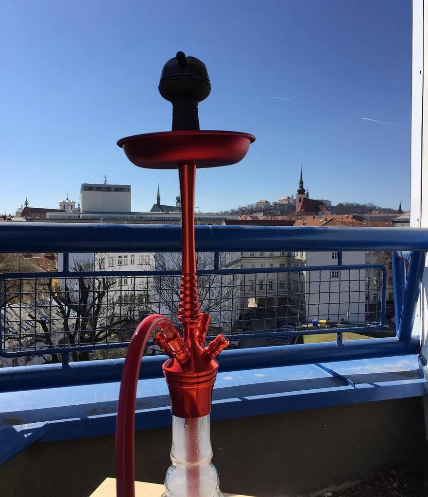 Smoking hookah on the balcony