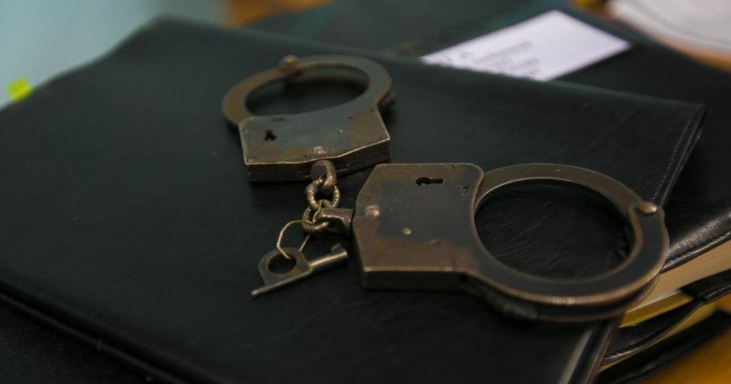 Handcuffs and folder